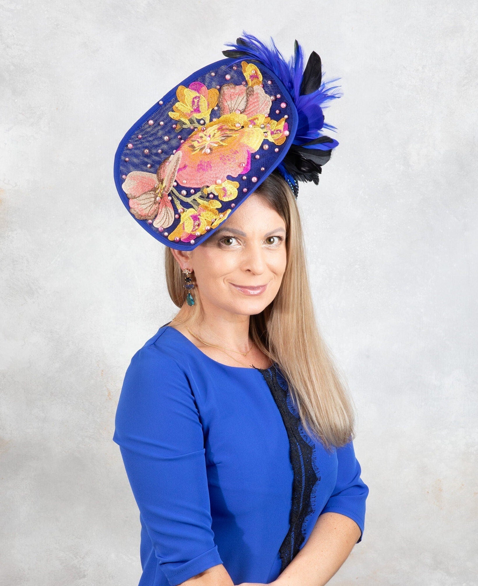 Blue outlet air hostess fascinator with loops, hydrangers and arrow feather!