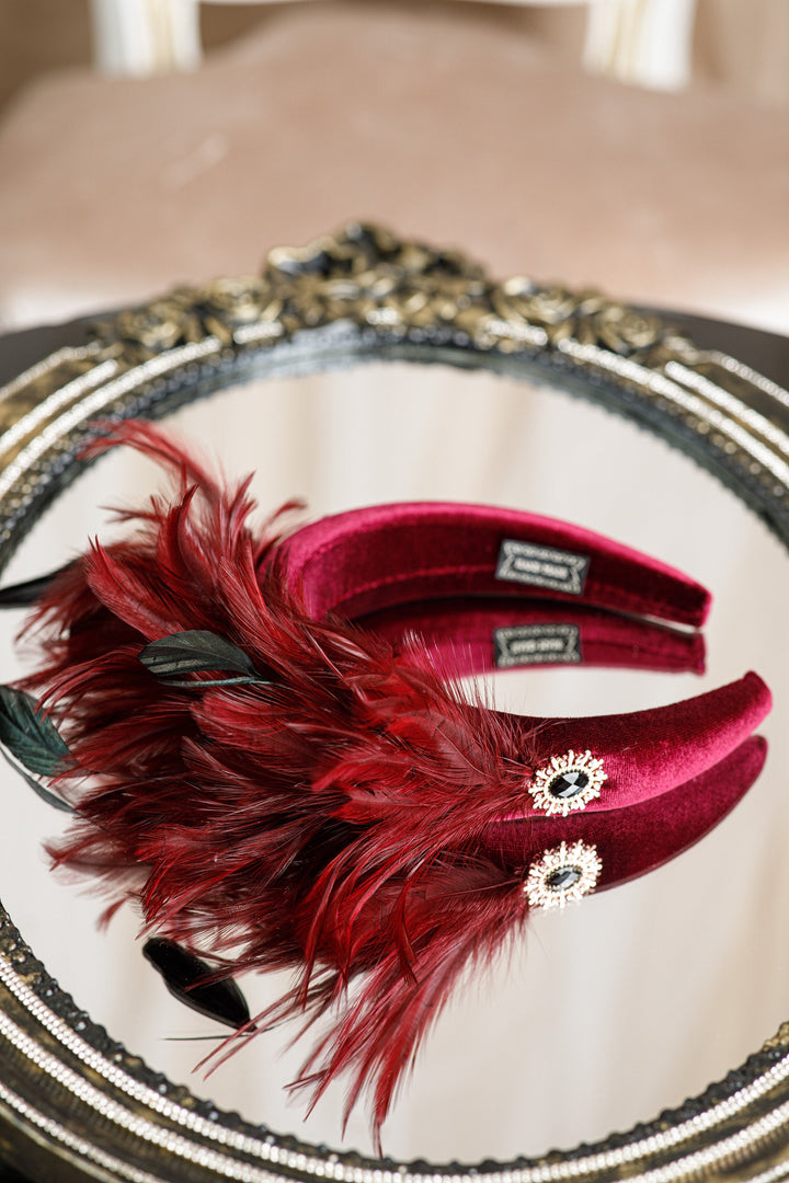 Burgundy fascinator with feather