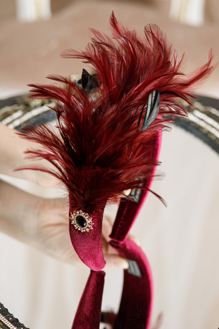 Burgundy fascinator with feather