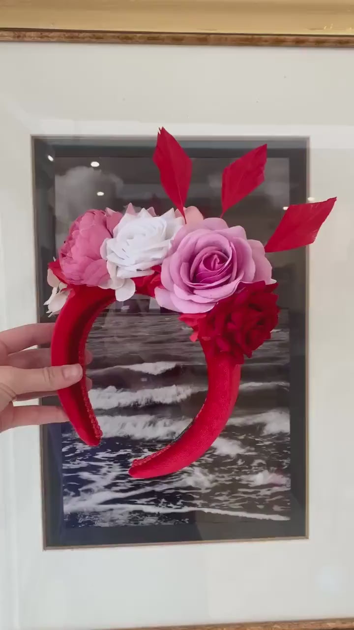 Padded fascinator with red pink flowers