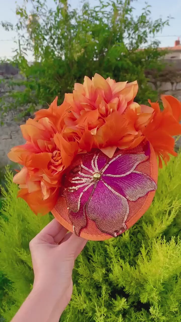Bright orange mini hat with pink embroidered